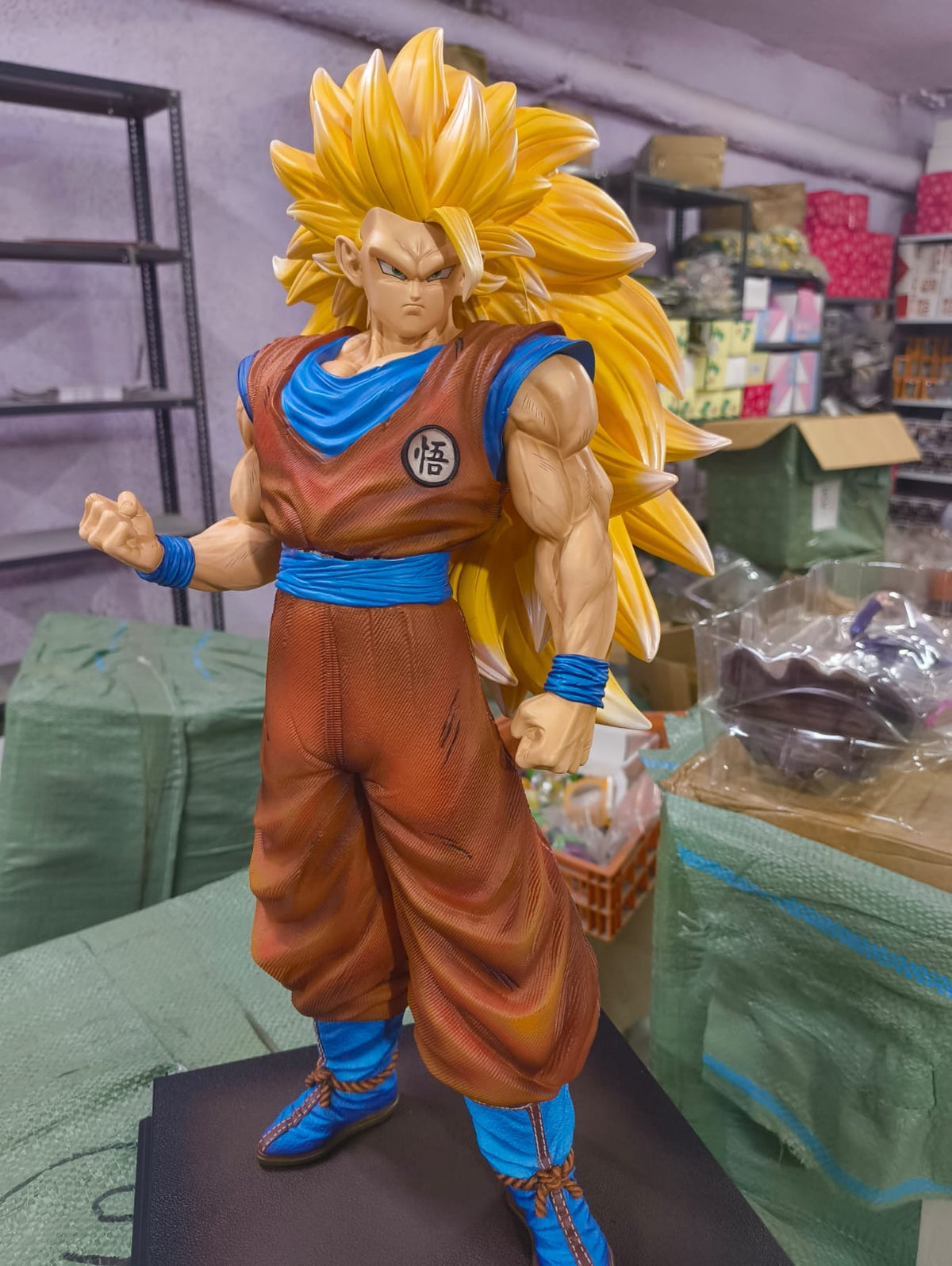 Actual Super Saiyan 3 Goku 50 cm figure front reference photo with golden hair, orange gi, blue sash and black base