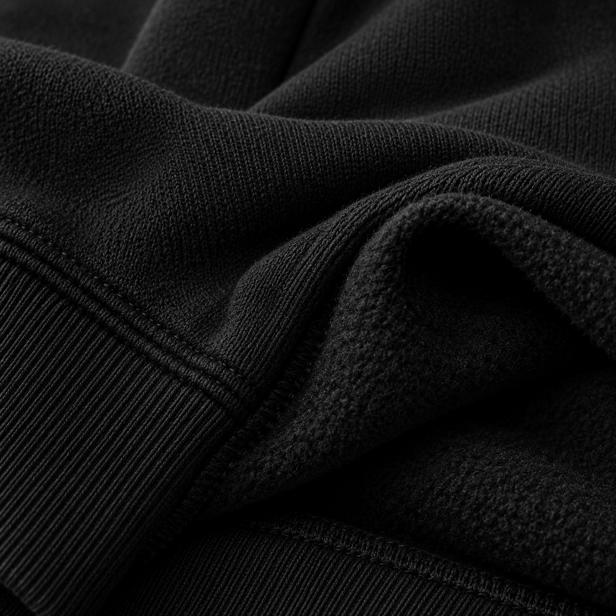 My Store black oversized hoodie fabric showing soft fleece lining and ribbed cuff detail