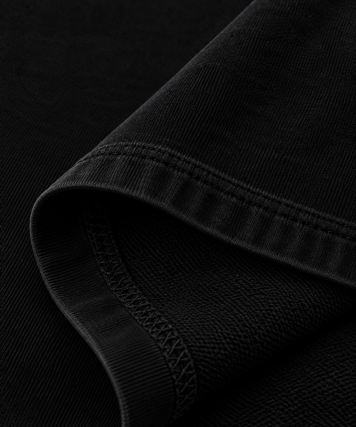 Black oversized T-shirt fabric and hem stitching detail