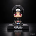 Itachi Uchiha sitting anime bobblehead figure in black Akatsuki cloak with red Sharingan eyes and Naruto display base, front view