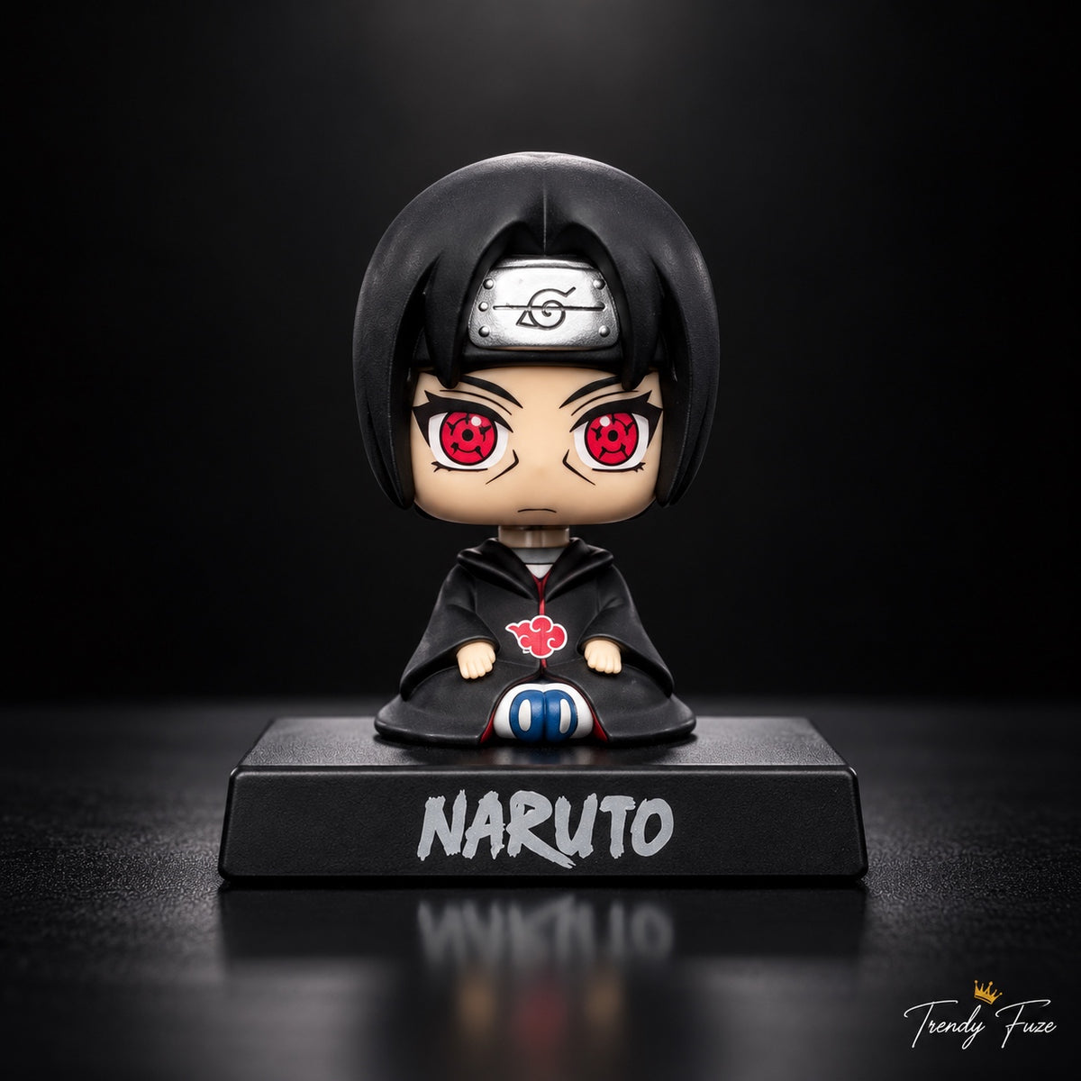 Itachi Uchiha sitting anime bobblehead figure in black Akatsuki cloak with red Sharingan eyes and Naruto display base, front view