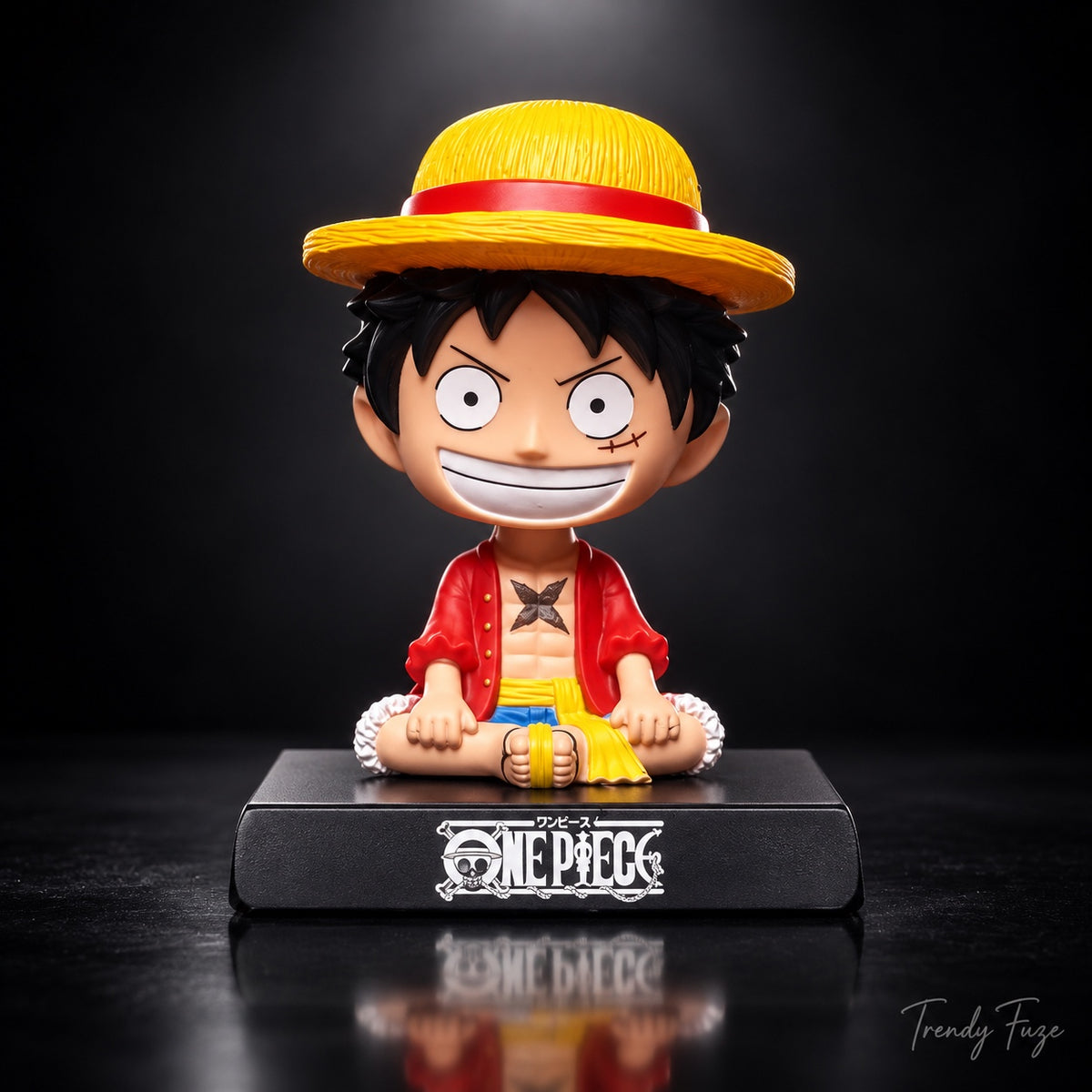 Monkey D. Luffy sitting One Piece anime bobblehead figure front view with straw hat and black display base