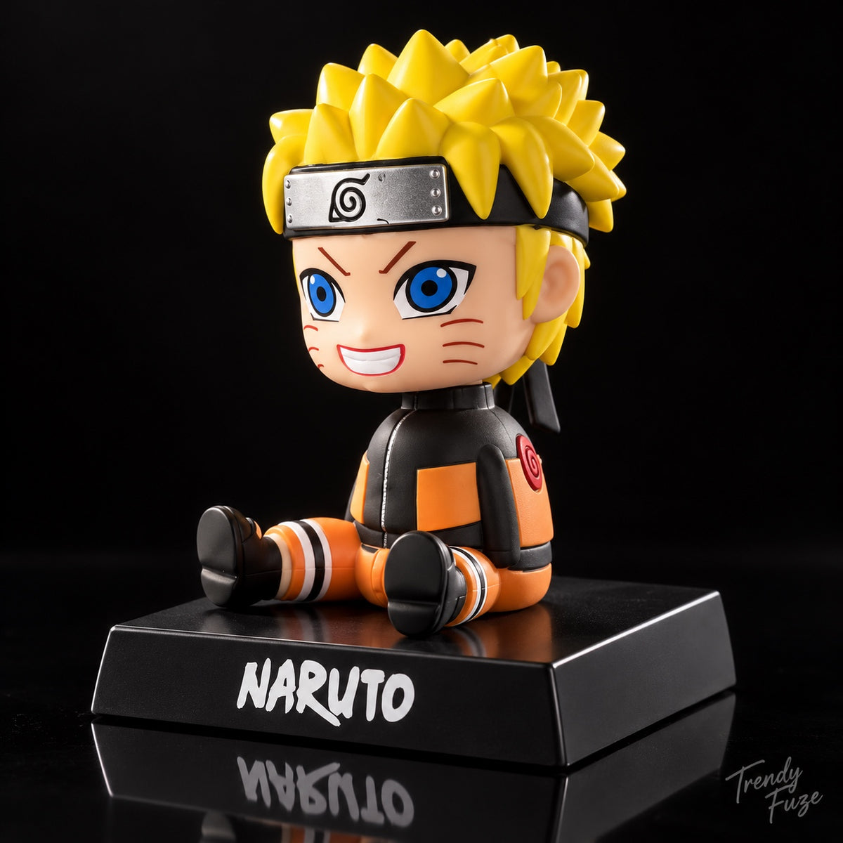 Naruto Uzumaki sitting bobblehead side angle showing ninja headband, orange jacket and black display base