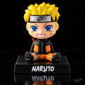 Naruto Uzumaki sitting bobblehead figure front view with yellow hair, blue eyes, orange outfit and Naruto base