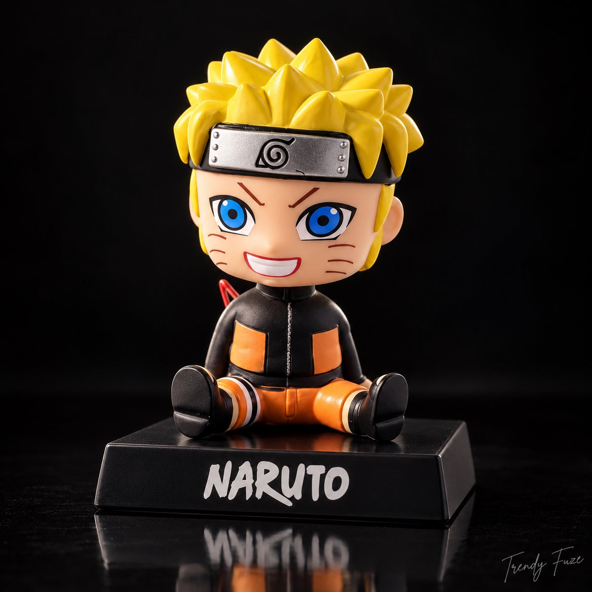 Naruto Uzumaki seated anime bobblehead collectible with bright yellow hair on Naruto display base
