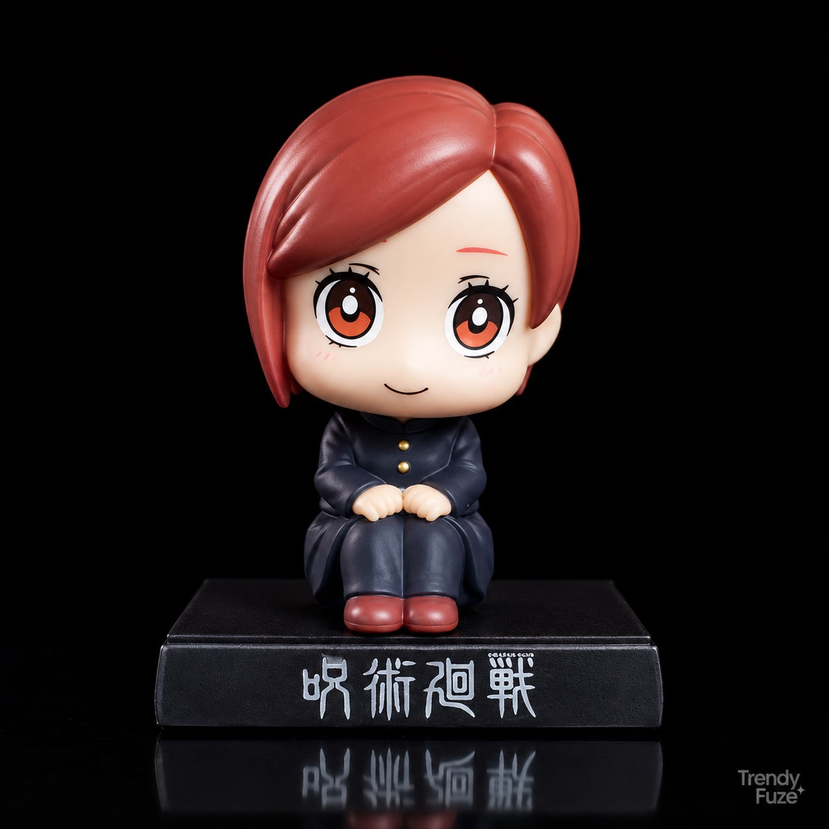 Nobara Kugisaki sitting Jujutsu Kaisen bobblehead-style anime figure with auburn bob-cut hair, black school uniform and red-brown shoes, front view