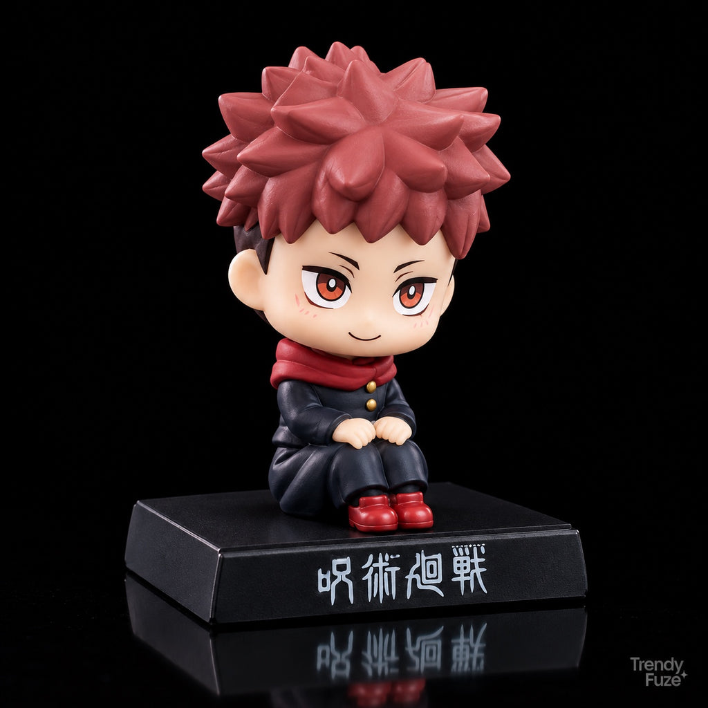 Yuji Itadori Jujutsu Kaisen chibi seated collectible viewed at an angle with pink spiky hair, red collar, black uniform, red shoes and black display base