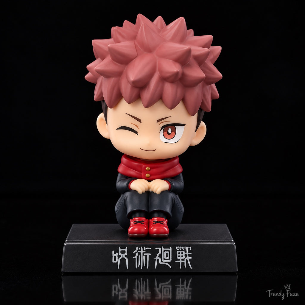 Yuji Itadori Jujutsu Kaisen sitting bobblehead figure front view with pink spiky hair, black uniform, red hood, winking expression and display base
