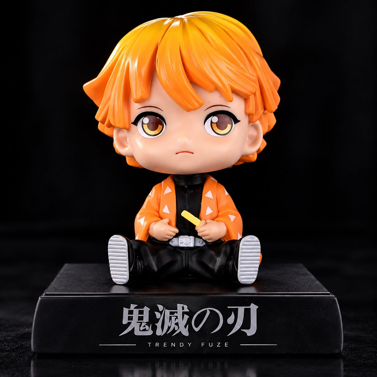 Zenitsu Agatsuma Demon Slayer sitting bobblehead figure front view with orange hair and orange patterned haori on display base