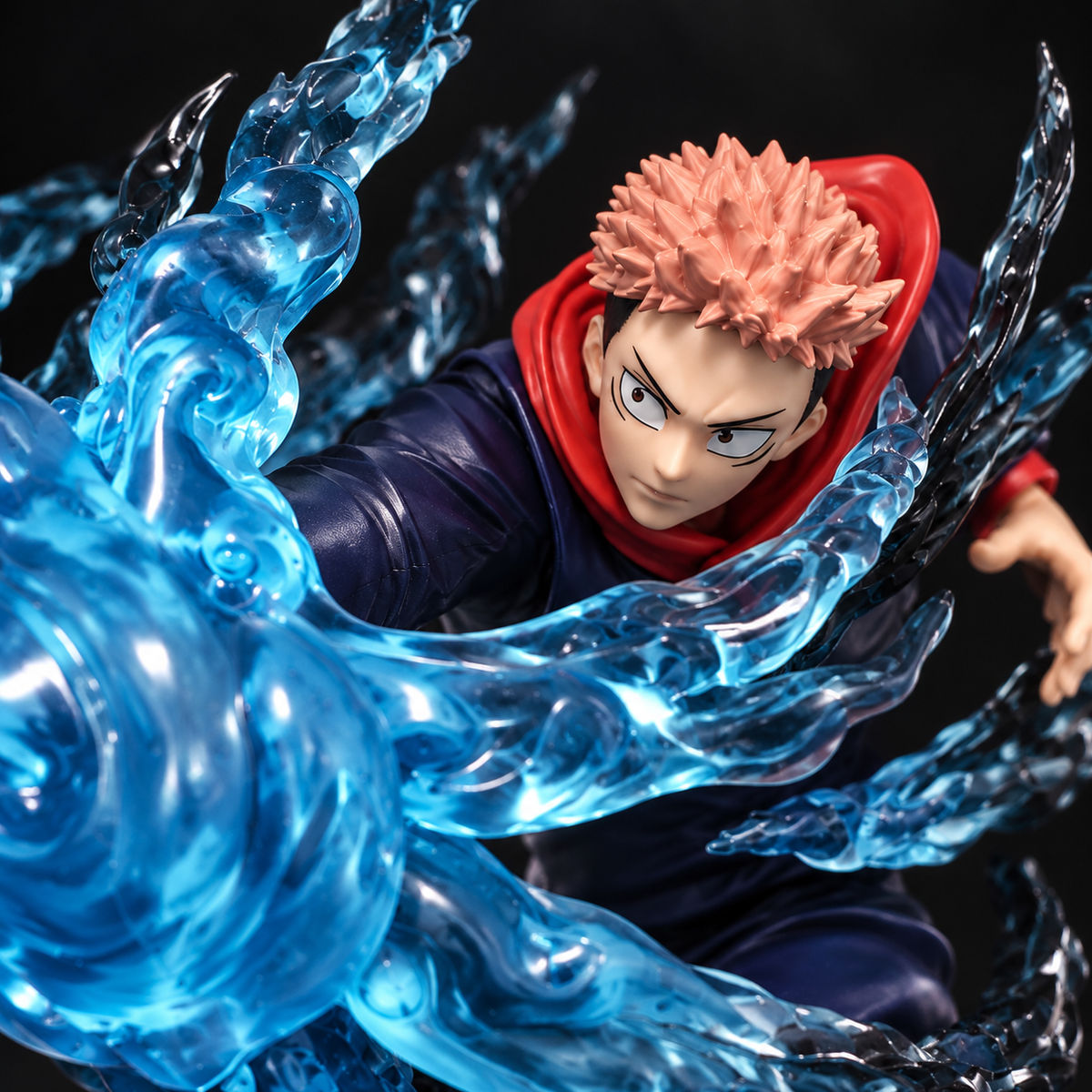 Yuji Itadori action figure close-up with blue cursed energy effects