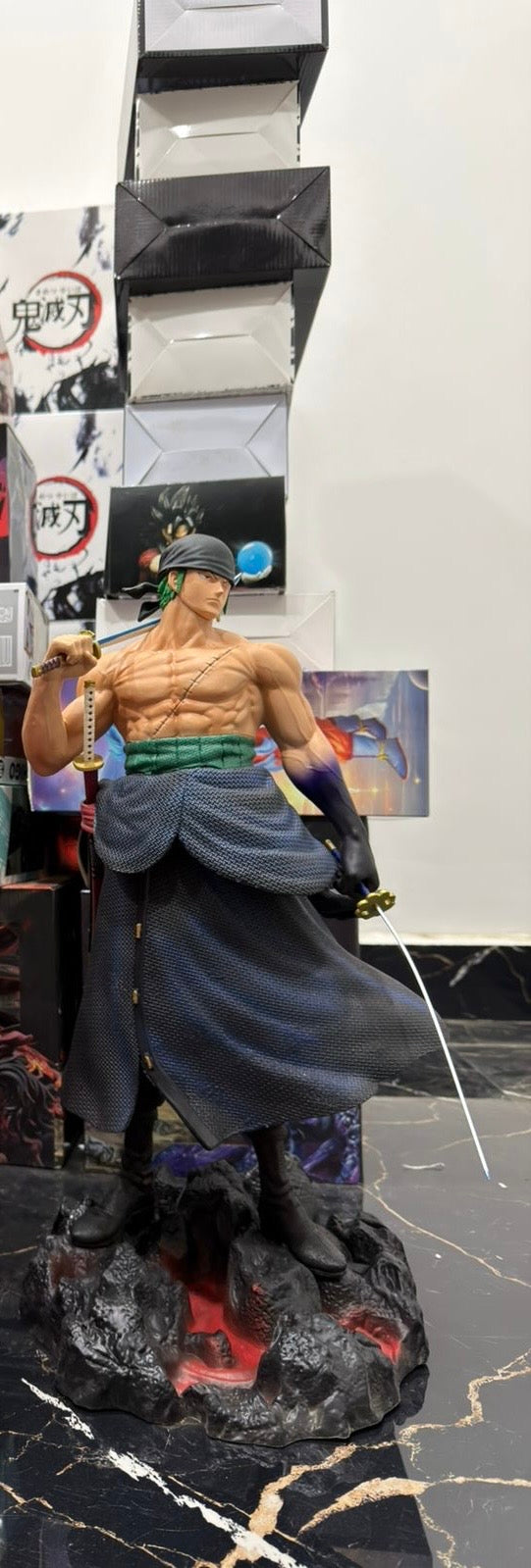 Actual Roronoa Zoro 50 cm product reference showing black bandana, green sash, swords and rocky base